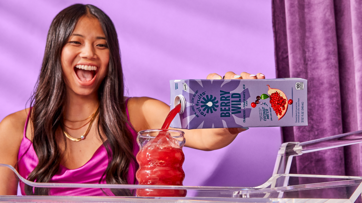 berry wild juice being poured into a glass