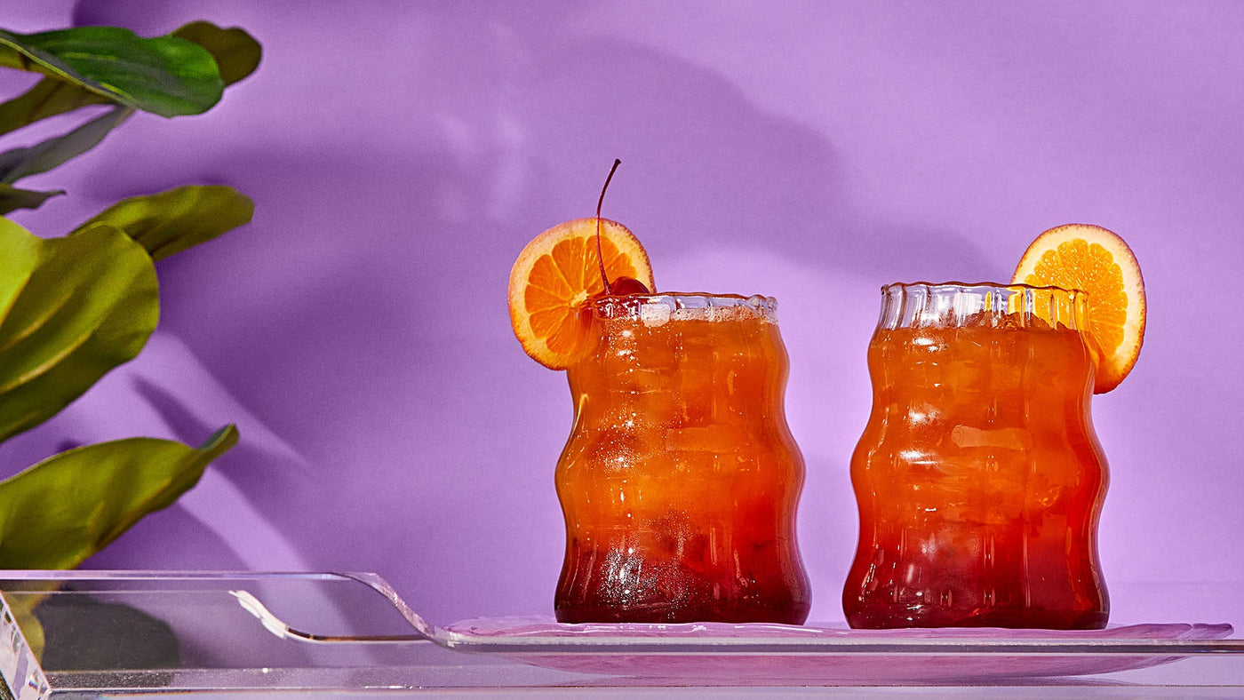 Tropical Tequila Sunrise made with Revl Fruits juice.